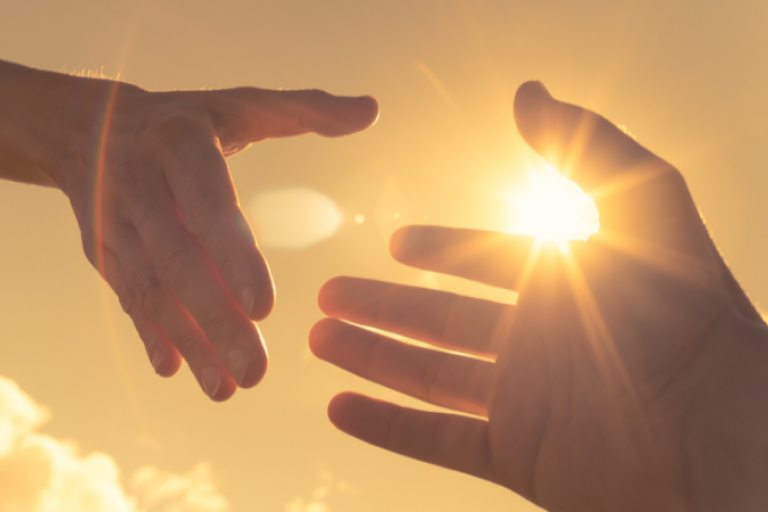 Hands in front of the sun