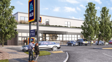 Exterior CGI of Aldi supermarket with cars parked outside and pedestrians walking.