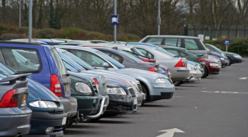 A line of parked cars in a car park