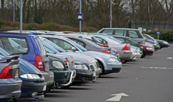 A line of parked cars in a car park