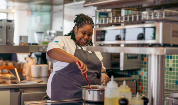 Cook preparing food in professional kitchen