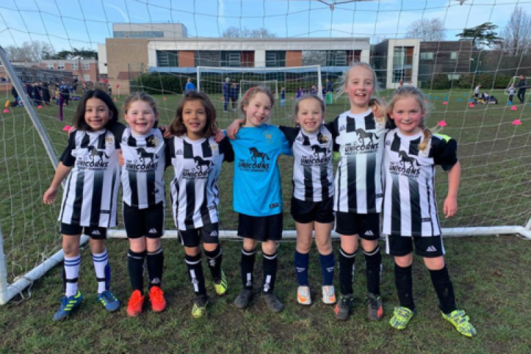 Molesey Juniors FC team standing in front of the goal