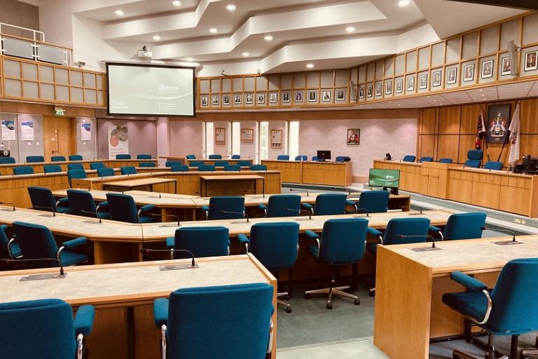 Council Chamber with seating and screen