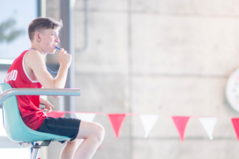 Lifeguard watching swimming pool