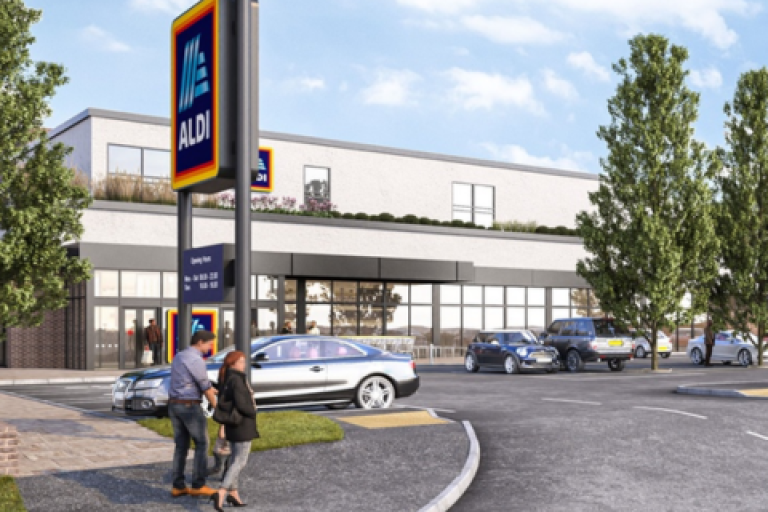 Exterior CGI of Aldi supermarket with cars parked outside and pedestrians walking.