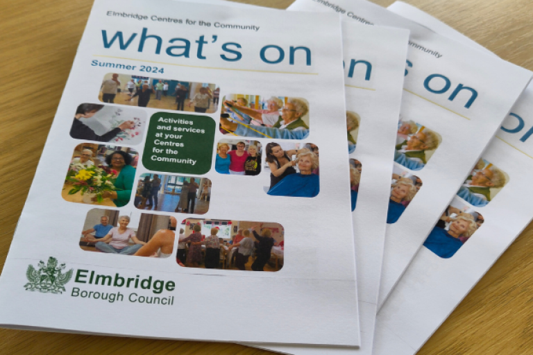 Stack of Centre's activity booklets with title 'What's on'