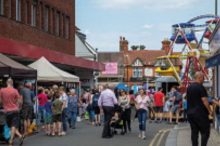Community enjoying an event in Walton-on-Thames