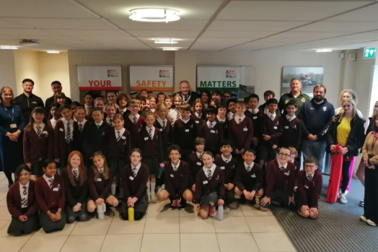 group of school children alongside Cllr Kirsty Hewens and Mayor of Elmbridge, Cllr Neil Houston