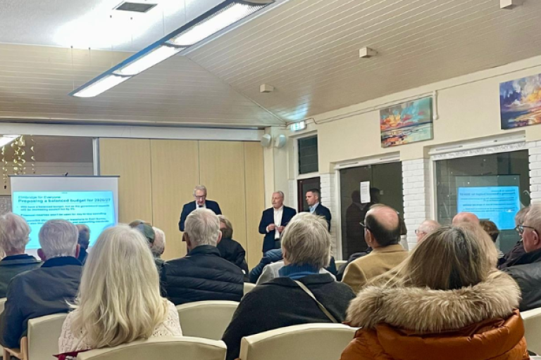 Audience sat facing the Leader and Deputy Leader of the council who are presenting