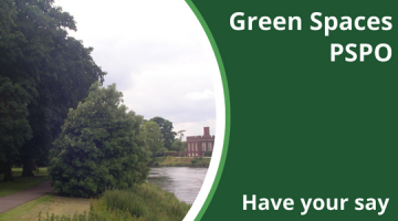 A riverside grassy area with a house in the distance.