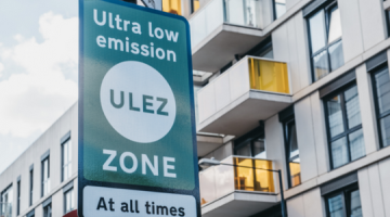 A ULEZ sign in front of apartments