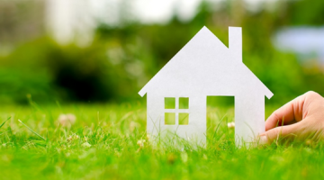 White model house placed on grass