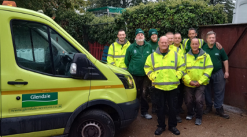 The team at Glendale standing next to a branded van.