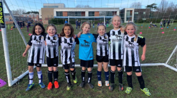 Molesey Juniors FC team standing in front of the goal