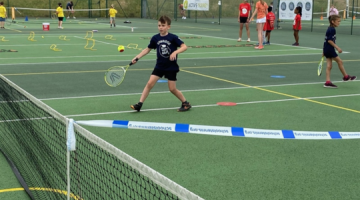 Young boy playing tennis in the Surrey Youth Games