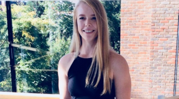 Emma Cleal smiling in front of a window