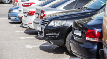 Cars parked in parking spaces of a car park