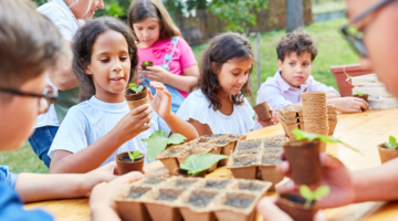 Children planting vegetables in school garden