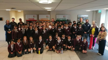 group of school children alongside Cllr Kirsty Hewens and Mayor of Elmbridge, Cllr Neil Houston