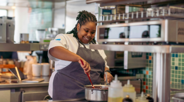 Cook preparing food in professional kitchen