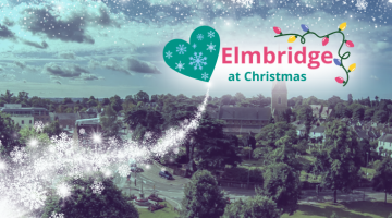 Birds eye view of Esher, tinted blue with snow and the Love Elmbridge at Christmas logo