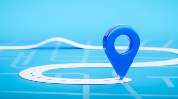 Clean routes. Pin on a map showing destination and outline of road leading to it.